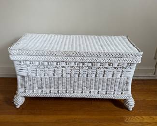Adorable white wicker storage bench. Measures 33 inches wide by 15 inches deep by 18 inches high. Good condition.