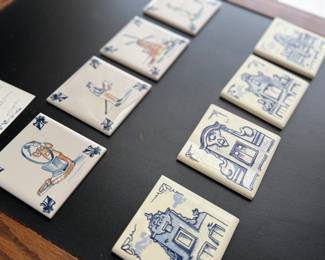 Eight piece set KLM business class 3” x 3” delft blue tiles. All have different images.