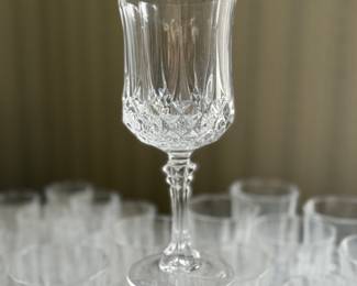 A large collection of Langdon Crystal, very heavy. Includes (12) 4 inch tall glasses,(12) 5 inch tall water glasses, (9) 7 inch tall stemmed wine glasses, (11) 8” tall stemmed wine glasses, (8) 4.5” cordial glasses and 12 dessert stemmed bowls. All are matching and excellent quality.