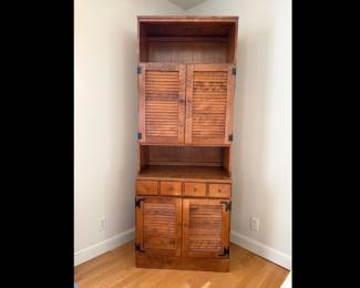 1970s Ethan Allen tall shutter door cabinet. Wood construction with a formica top. From the heirloom maple collection. Great condition. Measures 30 inches wide by 18 inches deep by 78 inches tall. Matches lot 93.