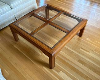 Very large wood and glass coffee table. Measures 36“ x 36“ x 15“ tall. Good condition.