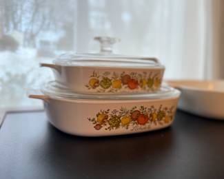 2 corning ware covered casseroles with Pyrex lids. Spice of life pattern. One measures 8“ x 8“, other is a 1 quart. Plus one corning ware casserole dish in the blue corn flower pattern. No lid. Measures 10“ x 10“. Plus 2 white ceramic tea caddies.