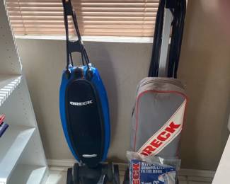 A Pair Of Orecks With Spare Bags And Belts