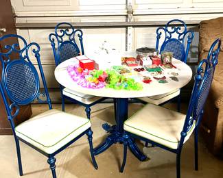 Vintage laminate top table with four metal chairs and metal base