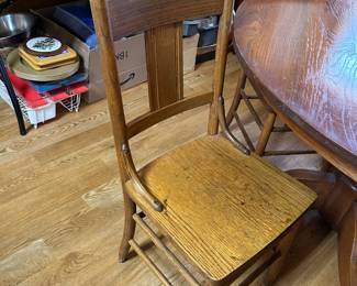 #29	round oak pedistal table with 4 wood chairs48x29	 $140.00 
