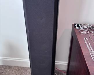 Black floor-standing tower speaker