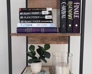 Industrial bookshelf with books and decor