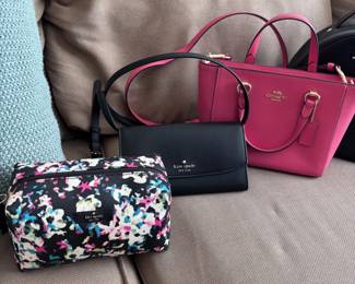 Coach pink satchel, Kate Spade black wallet, floral cosmetic bag
