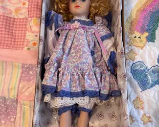 Porcelain collector doll in original box, blue floral dress
