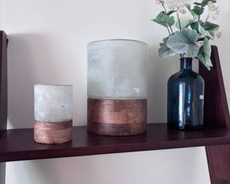 Dark blue glass bottle vase with faux eucalyptus, candle, copper decor