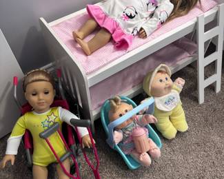 American Girl dolls with bunk bed, stroller, and accessories
