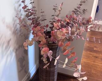 Wicker basket with dried eucalyptus floral arrangement