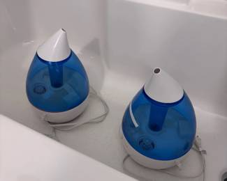 Pair of blue cool mist humidifiers