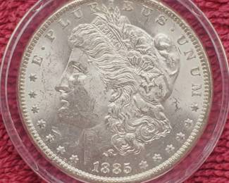 1885-O Morgan Silver Dollar in Airtite, Higher Grade
