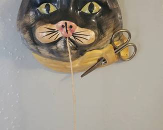 Wall mounted cat head string holder 