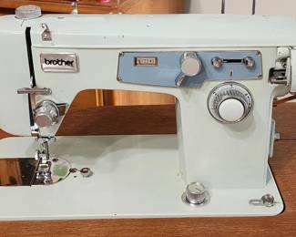 Brother sewing machine model C with knee paddle operations & sewing accessories, wooden thread spools