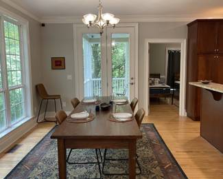 Solid wood dining table. Leather dining chairs, Rug