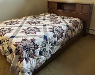 Mid-century modern full-size bed with bookcase headboard and a Vintage Lone Star Quilt