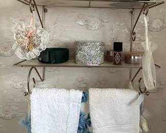 Vintage Vanity Shelf with Assorted Perfume Bottles and Bathroom Accessories