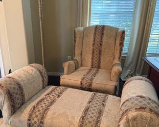Oversized arm sling back chair with matching ottoman.