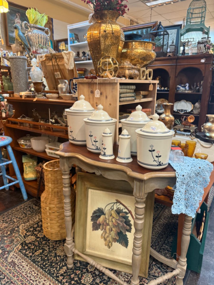 Framed botanical art, vintage canisters, baskets, brass vase
