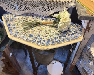 Decorative accent table featuring a mosaic top 