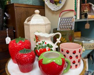 strawberry collectibles, side table, vintage grater, collectible hanging plate