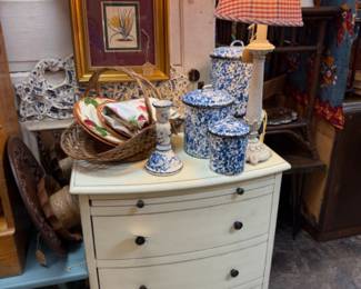 accent chest, lamps, blue speckled canisters, baskets, framed art