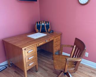 Primary Bedroom 
Oak desk
Oak chair
Leather bag
