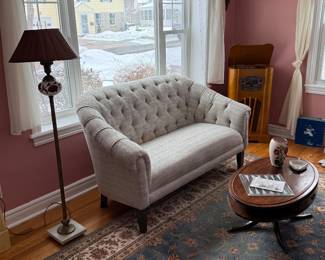 Living Room 
Chesterfield loveseat
Area Rug
Early floor lamp 
Oval coffee table 