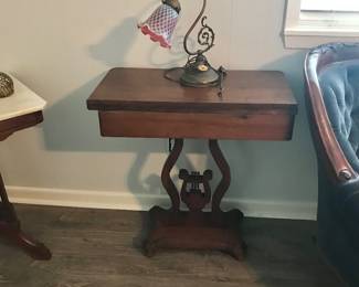 Lyre table and antique lamp