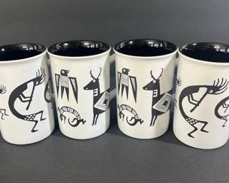 Set of four ceramic coffee mugs featuring a Mimbreostyle bighorn sheep design in black on a white 