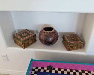 vintage clay vessel with a woven rim
