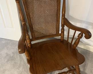 Vintage rocker with caned back in excellent condition...so lovely!