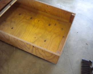 Heavy duty work table made of joined 2x4s with roll under storage