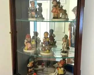 Curio Cabinet with 6 Goebel Hummel Figurines and 1 Napco Little Vet Figurine