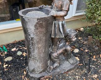 fountain, girl standing on boy