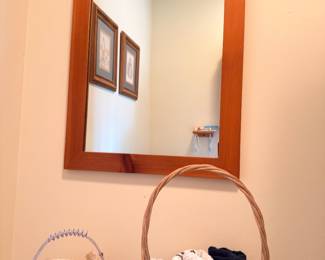 Cherry wood framed wall mirror, wicker basket