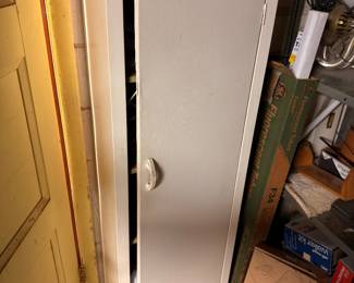 White panel door, garage storage items