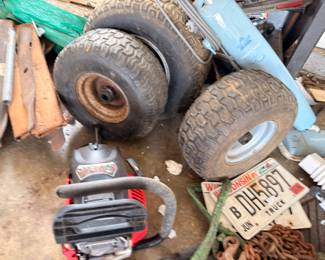 Spare tires, vintage license plates, garage items