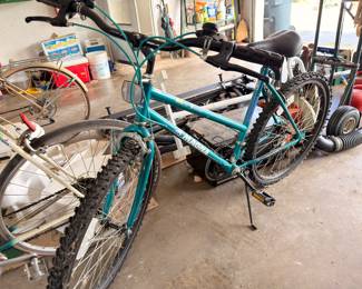 Teal mountain bicycle, garage equipment