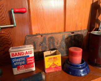 Vintage Band-Aid tin, antique license plate, cobalt pottery