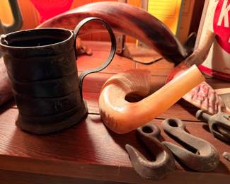 Antique powder horn, tin cup, vintage wrenches and tools