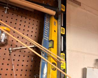 Workshop pegboard, levels, clamps, hand tools