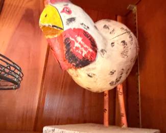 Folk art painted chicken figurine on stone base