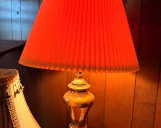 Brass table lamp with red pleated shade