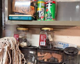 Jars of nails and screws, rope, spray paint, garage hardware