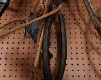 Pegboard with rope, hand tools, leather straps