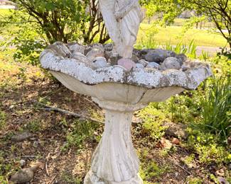 Concrete garden birdbath with angel cherub figure