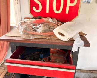 Vintage stop sign, red metal toolbox, workshop